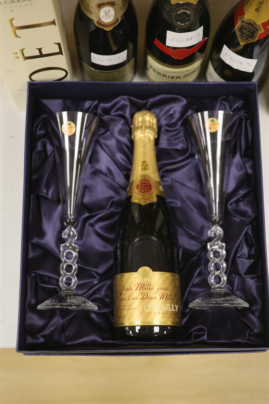 Four bottles of NV Champagne and  Maiily Millennium Champagne with two glasses